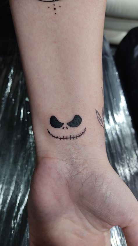 35 Times Horror Lovers Got Spooky Halloween Tattoos, And They Worked Brilliantly Jack Skellington Face Tattoo, Jake Skellington Tattoo, Small Jack Skellington Tattoo, Small Linework Tattoo Design, Zero Dog Tattoo, Jack Skellington Tattoo Ideas, Jack The Skeleton Tattoos, Nbc Tattoo, Small Nightmare Before Christmas Tattoo