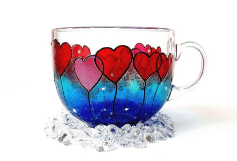 Enjoy your morning cuppa with a bit of love in a unique hand painted mug. This elegant glass coffee mug is hand painted with hearts. The hearts are painted different shades of red with a little bit of glitter as well. The mug is painted in blue. Glass Mug Painting Ideas, Van Gogh Design, Glass Painting Patterns, Customized Mug, Mom Daughter Gifts, Different Shades Of Red, Glass Painting Designs, Glass Bottles Art, Hand Painted Mugs