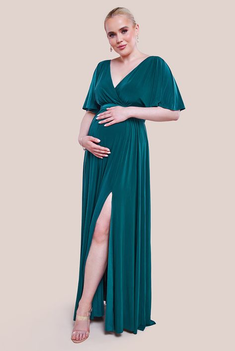 Get ready to embrace maternity chic with our delightful green wrap front maxi dress featuring flutter sleeves! Crafted with care and comfort from the Goddiva summer collection, this Emerald dress is your go-to choice for a myriad of occasions during your maternity journey. Whether you're attending a garden party, enjoying casual outings, or catching up with friends over brunch, this versatile...