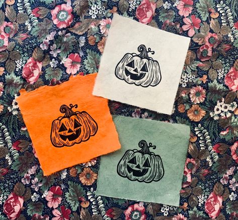 Tiny linocut pumpkins on lokta paper #jackolantern #pumpkins #pumpkinart #linocutprints #linocut #reliefprint #blockprint #printmaking #loktapaper #printmaker #halloweendecor #trickortrear #october #autumn #falldecor #jackolanterncraft #etsy Halloween Crafts To Sell, Relief Printmaking, Lantern Craft, October Autumn, Lino Art, Lokta Paper, Relief Printing, Handmade Stamps, Printmaking Art