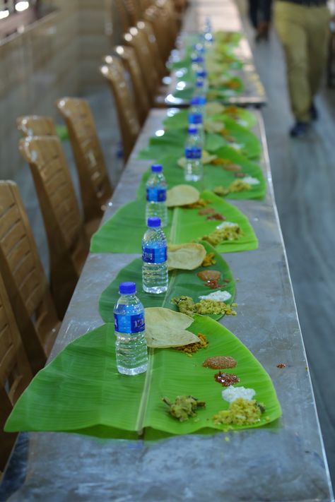 water bottle, banana leaf, chairs, table, marriage, wedding, party, tamil nadu, south Indian, food Banana Leaf Food, Banana Leaf Plates, African Snacks, Tropical Room, Mobile Ideas, Wedding Lunch, Rice Wraps, Lunch Table, Kerala Wedding