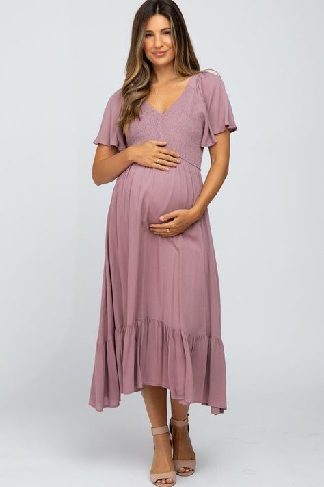 A solid maternity midi dress. Features smocked bust with v-neckline, short bell sleeves, and ruffle hemline. Skirt is lined. Baby Shower Outfit Ideas, Short Bell Sleeves, Pinkblush Maternity, Shower Outfits, Maternity Midi Dress, Valentines Day Dresses, Baby Shower Dresses, Maxi Gown Dress, Mauve Dress