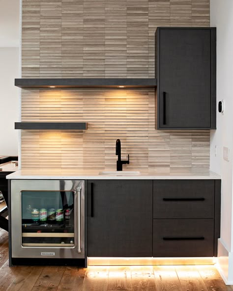 A little moody modern wet bar inspo for your Thursday 🖤🍸

Milano Finish : Anthracite Linen Wet Bar Tile Ideas, Small Bar With Sink And Fridge, Wet Bar Master Suite, Tiny Bar Ideas For Home, Organic Modern Basement Bar, Wet Bar Room Ideas, Ikea Wet Bar Ideas, Wet Bar In Master Suite, Small Basement Kitchenette Ideas