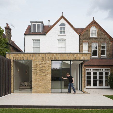 This London extension by Tigg Coll Architects features sliding doors that retract into the walls to open the house up to the garden. Brick Extension, Minimal Windows, Terrasse Design, Roof Extension, Glass Extension, Modern Extension, House Extension Design, Rear Extension, Sliding Glass Doors