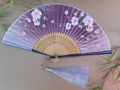 Handheld Folding Hand Fan with a Pouch and Optional Fan Gift Box  High-End Style Folding Hand fans Designs are fashionable and  High-Quality are nifty little products which are ideal for day-to-day personal use, presenting as gifts, using as decorations, wedding or party favours, or cosplay accessories. It comes with a beautifully handcrafted gift box just made for these skillfully crafted fans and a super soft fabric pouch, which adds more luxury. The gift box is wrapped in a cellophane bag. Th Fabric Hand Fan, Folding Fabric, Boss Lady Outfit, Red Spider Lily, Colorful Gift Wrapping, Folding Fans, Flowers Artwork, Purple Accessories, Folding Hand Fan