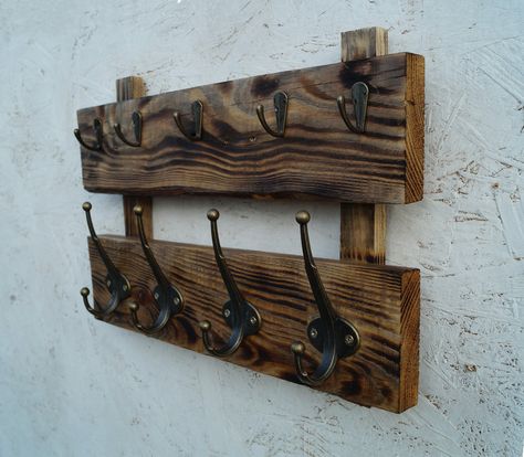 This wooden coat rack wall mount is the perfect decor for your home. On the top panel are small hooks for keys. On the bottom - powerful hooks for clothes. The coat rack is made of natural wood. This is old wood. I restored it. Reclaimed wood exhibits some gorgeous features - knots, old nail/screw marks, and grain designs that look amazing. Repeat is not possible. Since the pattern of the tree is unique. This is the value of such products. Other options are Barnwood coat rack- https://etsy.me/3a Hat Rack Diy Wall, Barnwood Coat Rack, Barnwood Projects, Burnt Wood Finish, Coat Rack Wall Mount, Wooden Coat Hooks, Wood Coat Rack, Rustic Wall Shelves, Rough Wood