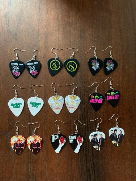 Show your love of punk with a pair of Green Day guitar pick earrings! Fish hook earring style made of nickle free rhodium. Guitar pick made of plastic. Choose your favorite style. Cheap Punk Style Earrings For Gift, Punk Gift Ideas, Funky Crafts, Cheap Music-themed Earrings For Pierced Ears, Green Day Guitar, Random Jewelry, Grabby Hands, Guitar Pick + Necklace Cheap, Crafty Jewelry