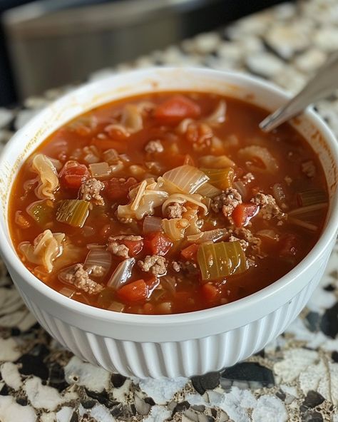 Warm up with a bowl of comfort food bliss with our Cabbage Roll Soup Recipe. This hearty soup brings the beloved flavors of traditional cabbage rolls into an easy-to-make, one-pot meal that's perfect for cozy nights or family gatherings. Featuring tender chunks of cabbage, savory ground beef, and a rich tomato base, this cabbage roll soup is both satisfying and nutritious. The blend of spices and herbs adds depth and warmth, making each spoonful a delightful experience. Ideal for those who love Hamburger Cabbage Recipes, Ground Beef Cabbage Recipes, Soups With Hamburger Meat, Cabbage And Chicken Recipes, Low Carb Cabbage Recipes, Ground Beef Comfort Food Recipes, Recipes Using Cabbage, Cabbage And Ground Beef Recipes, Cabbage Soup With Ground Beef