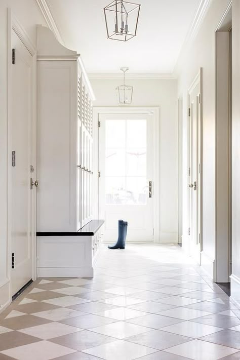 Darlana Lantern illuminates a foyer designed with white and taupe harlequin floor tiles, white built ins and cabinet storage space. Harlequin Tile, Harlequin Floors, White Built Ins, Home Decor Eclectic, Mudroom Flooring, Foyer Flooring, Entrance Way, Decor Eclectic, Mudroom Design