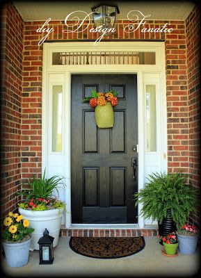 Front Door Colors for Brick Homes | Choosing A Paint Color To Personalize Your Front Door Small Front Porches Designs, Orange Brick Houses, Front Porch Design Ideas, Black Front Door, Porch Design Ideas, Front Porch Makeover, Orange Brick, Black Front Doors, Front Porch Design