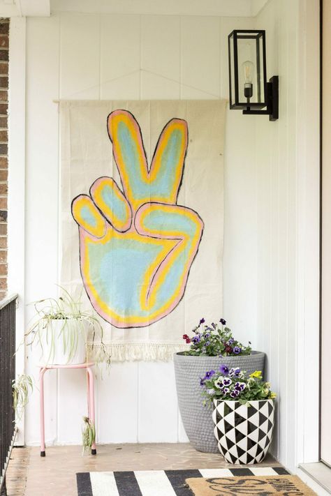 Learn how to make an adorable no-sew banner for your porch using paint and a drop cloth! Diy Peace Sign, Boho Banner, Brick Ranch Home, Door Accents, Umbrella Wreath, Feeling Uninspired, Small Porch Decorating, Tissue Paper Garlands, Outside Paint