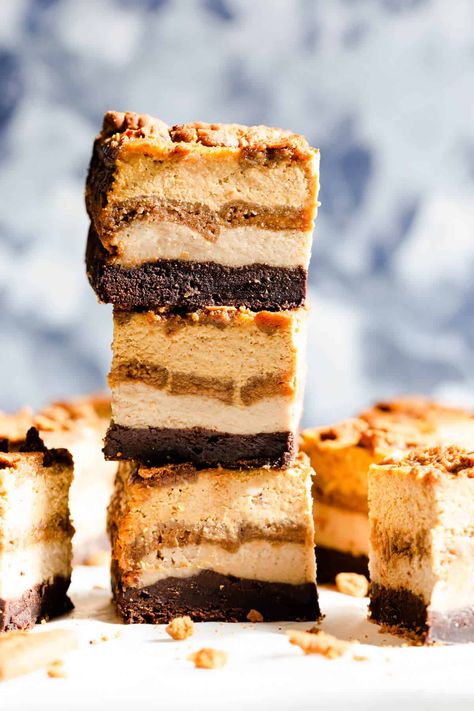 Discover these irresistible pumpkin biscoff cheesecake brownie bars from Anna Banana! The creamiest and most decadent treat for this autumn! Made with layers of rich brownie, biscoff cheesecake & biscuits and creamy pumpkin cheesecake layer #pumpkin #dessert Pumpkin Biscoff, Pumpkin Granola Bars, Cheesecake Brownie Bars, Cheesecake Layer, Brownie Bars, Cheesecake Brownie, Biscoff Cheesecake, Pumpkin Cheesecake Bars, Pumpkin Cheesecake Recipes