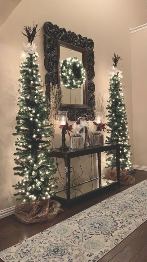 Christmas Entry Way Decorations, Western Flocked Christmas Tree, Split Level Entryway Christmas Decor, Xmas Foyer Decorating Ideas, Entry Way Christmas Trees, Christmas Vintage Decor Ideas, Christmas Tree In Front Of Fireplace, Christmas Tree In Foyer Entryway, Two Christmas Trees Side By Side