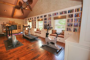 I don't like the design of this room, but I do like the concept of a library/home gym room with window seats. Library And Gym Room, Ruang Gym, Gym Design Ideas, Home Gym Layout, Basement Home Gym, Building A Home Gym, Dream Home Gym, Tiny Loft, Library Home