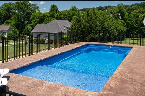 A simple budget-friendly inground fiberglass pool installation with great features including a tanning ledge, stairs, and seating in the deep end. Shallow Inground Pool, Inground Pool Ideas Simple, In Ground Pool With Tanning Ledge, Inground Pool Ideas With Tanning Ledge, In Ground Rectangle Pools, Simple In Ground Pool Ideas, Inground Pool Tanning Ledge, Simple Pool Ideas Inground, Simple Swimming Pool Designs