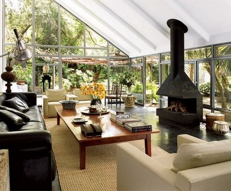 Sunroom With Fireplace, Eclectic House, Freestanding Fireplace, Mediterranean Homes, Design Your Dream House, Spacious Living Room, Fireplace Design, Outdoor Rooms, Architectural Digest