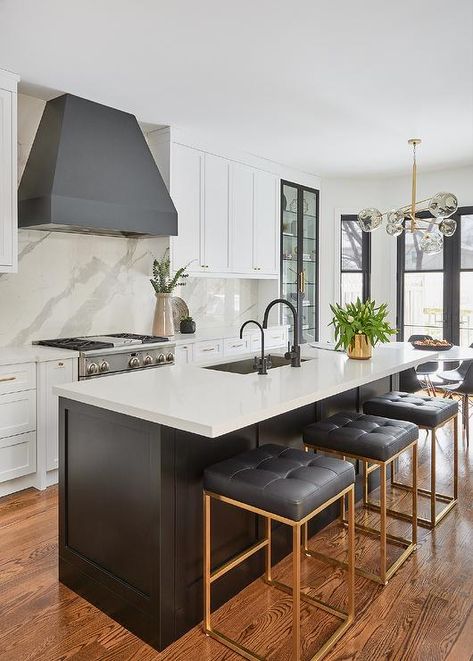 Three Nuevo Chi Stools are placed at a black shaker island donning a white quartz countertop and fitted with a stainless steel sink and a matte black gooseneck faucet. Ikea Black, Black Island, Black Kitchen Island, New House - Kitchen, Classic Kitchen, Transitional Kitchen, Kitchen Inspiration Design, Unique Kitchen, Black Kitchens