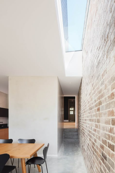 Updated Sydney Home by Marston Architects | est living Skylight Design, Brick Interior, Metal Pergola, Hallway Designs, Brick Walls, White Rooms, Roof Light, Exposed Brick, Concrete Floors