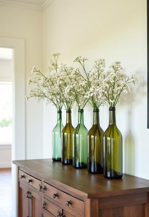 Empty wine bottles offer endless possibilities for creative home decor and upcycling projects. From elegant vases to unique lighting fixtures, these versatile containers can transform any space. With a little imagination, you can turn ordinary bottles into extraordinary art pieces. There's a simple trick to elevate your upcycled creations that most people overlook. Repurpose Wine Bottles, Flatten Wine Bottle, Upcycle Bottles, Rustic Towel Rack, Old Wooden Ladders, Old Wine Bottles, Old Glass Bottles, Thrifty Diy, Empty Wine Bottles