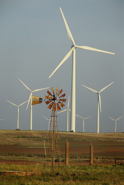 old surrounded by the new.... Wind Turbine Aesthetic, Eco Technology, Farm Windmill, Country Living Decor, Solar Punk, Vintage Foto's, Wind Mills, Blowin' In The Wind, Wind Generator