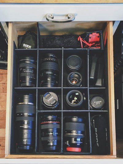 Camera equipment storage and organization - old shelf converted into easy lens and camera equipment storage by making compartmentalized spaces for each piece of gear. Photography Studio Storage, Camera Equipment Storage, Photography Gear Storage, Photography Equipment Storage, Camera Organization, Camera Gear Storage, Photography Storage, Photography Room, Photography Organizations