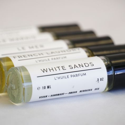 White Sands is a beachy and chic scent with a light citrusy-floral fragrance that reads subtly feminine. Feels like soft sand between your toes, a cold drink in your hand and your Out Of Office message turned on... Notes of: Bergamot / Mandarin / White Tea / Sandalwood Scent that is subtle yet lasts for hours. Our roll-on perfume oils are designed to use on-the-go or when you want a hit of luxurious scent on just-so spots. Use alone or layer scents for a personal touch that’s just exactly you! O Oil Perfume Packaging, Roll On Perfume Packaging, Layer Scents, Watching The Sunrise, Perfume Label, Easy Photography Ideas, Perfume Photography, Sandalwood Scent, Perfume Packaging