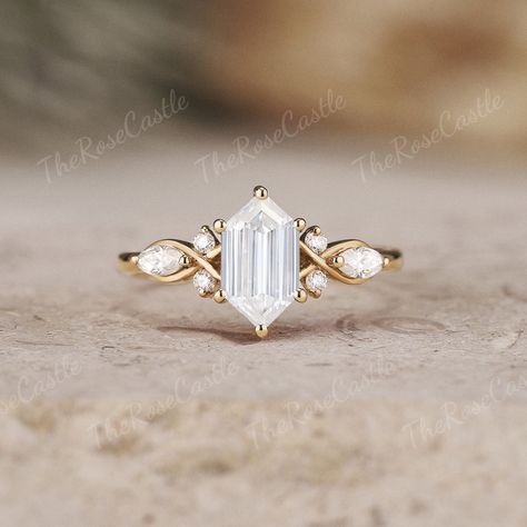 Link to Alexandrite Engagement Ring: https://www.etsy.com/listing/1583034784 Unique Hexagon Moissanite Engagement Ring Yellow Gold Marquise Moissanite Wedding Ring Minimalist Rings For Women personalized Jewelry ITEM DETAILS ●Available in yellow, white or rose solid 10k, 14k or 18k gold. This ring can be made in Platinum or sterling silver. ❀❀Center Stone: Moissanite Shape: Hexagon Shape Size: 5x9mm Side stone: Moissanite Shape: Round and Marquise shape Weight: about 0.26ct Band width around 1.5mm Visit my shop for more jewelry: https://www.etsy.com/shop/TheRoseCastle if you would like to customize your unique ring, you may contact us about your ideas and pictures. Hope I could get the chance to create fabulous rings for you! ❀Production ---- This ring is handmade and very good quality! Pl Unique Engagement Rings Without Diamonds, Emerald Antique Engagement Ring, Beach Engagement Rings, Triangle Engagement Ring Unique, Geometric Wedding Ring, No Traditional Engagement Rings, Marquis Cut Engagement Rings, Abstract Engagement Ring, Marquise Sapphire Ring