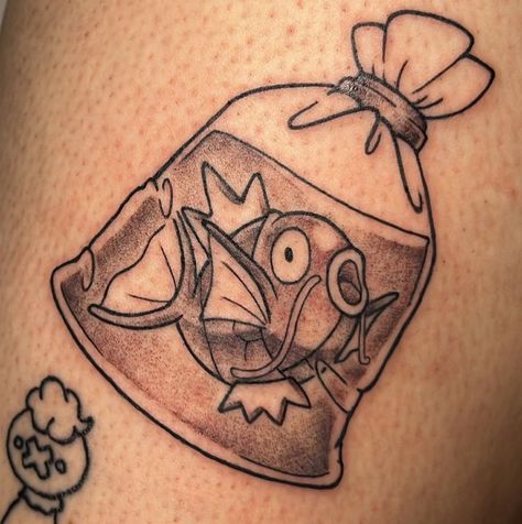 Fresh black and gray Magikarp tattoo by Maria Davis. #12ozstudios #team12oz #tattoo #tattoos #tattooed #tattooing #tattooism #tattooart #tattooartist #tattooer #tattooist #art #artstudio #tattooshop #tattoostudio #ink #inked #ladytattooers #animetattoos #pokemon #magikarp #blackandgraytattoos #pokemontattoos #gamer #gamertattoos Pokemon Go Tattoo, Magikarp Tattoo Design, Magikarp Drawing, Pokemon Patchwork Tattoo, Goomy Pokemon Tattoo, Magikarp Tattoo, Magikarp Art, Gyarados Tattoo, Porygon Pokemon