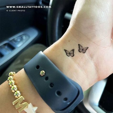 Looking for inspiration for your next tattoo? Check out our collection of 100+ butterfly tattoo designs! From small and delicate to large and bold, there's a butterfly tattoo to suit everyone. So what are you waiting for? Start browsing and find your perfect butterfly tattoo Symbols Of Change, Chest Neck Tattoo, Butterfly Couple, Universal Symbols, Butterfly Wrist Tattoo, Pretty Tattoo, Cute Simple Tattoos, Basic Tattoos, Tattoos Inspo