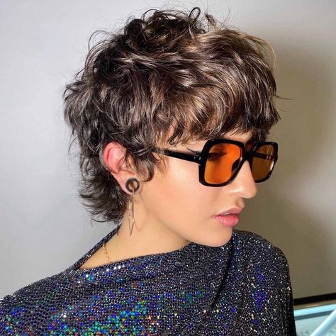 25 Whimsical Pixie Wolf Cut Ideas | HairAide Wavy Mod Haircut, Short Pixie Shag Haircut, Pixie Wolf Cut Hair, Wolf Pixie Cut, Grey Wolf Cut, Short Pixie Mullet, Pixie Wolf Cut, Short Wolfcut With Bangs, Short Curly Wolf Cut