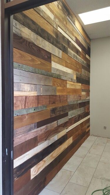 Wood pallet wall .  Made from fence boards and pallets from lowes, then stain and vinger, then nail gun. 3 days work. Pallet Garage Wall, Palet Wood Wall, Pallet Half Wall Ideas, Pallet Wood Garage Walls, Burnt Pallet Wood Wall, Bathroom Stone Wall, Wood Pallet Ideas, Pallet Accent Wall, Cracker House