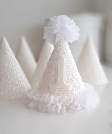 "This Item is Ready to Ship. Introducing our beautiful \"Pure\" white embroidered lace party hat, add a touch of elegance and whimsy to any party celebration. The party hat, crafted with love and attention to detail, features a delicate floral lace overlaid on white linen fabric. The white chiffon trim and pompom adds a delicate and feminine touch.  Party Hat: Luxurious lace floral embroidery pattern overlaid onto white linen. White chiffon trim for a delicate and feminine touch. White chiffon p Whimsical White Hat For Birthday, Playful White Hat For Birthday, White Piñata, White Party Hat With Round Crown, Adjustable White Mini Hat For First Birthday, Cute White Hat For First Birthday, Diy Party Hat, Princess 1st Birthday Party, Baby Romper Outfit