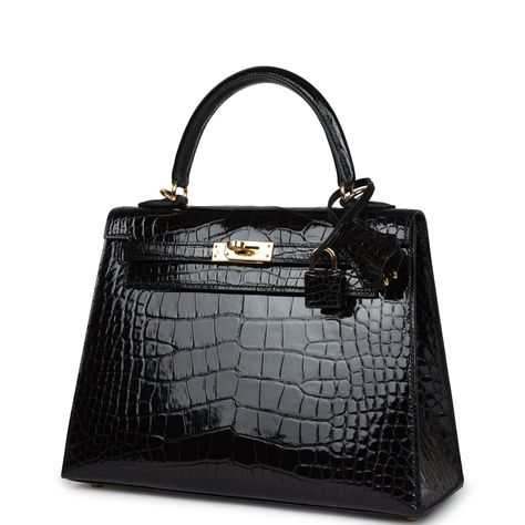 This Sellier Kelly is in Black shiny Mississippiensis alligator with gold hardware and has tonal stitching, front flap, two straps with center toggle closure, clochette with lock and two keys, single rolled handle and removable strap.The interior is lined with black chevre and has a zip pocket with an Hermes engraved zipper pull and two open pockets on the opposite side. Collection: ZOrigin: FranceCondition: New and never worn (Plastic on hardware)Accompanied by: Hermes box, Hermes dustbag, cloc Hermes Kelly Alligator, Black Hermes Bag, Mini Kelly Hermes, Hermes Kelly Black, Hermes Products, Kelly Hermes, Hermes Kelly Sellier, Black Kelly, Kelly Sellier