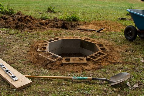 In ground fire pit..... gives me a few ideas with sub-ground grate and flat rocks around the top. Create an unseen key hole to feed the air to this.  Iterations with a mesh dome as well.  Great Pin. Ground Fire Pit, In Ground Fire Pit, Cinder Block Fire Pit, Fire Pit Gallery, Fire Pit Materials, Cinder Block Garden, Fire Pit Designs, Yard Project, Diy Fire Pit