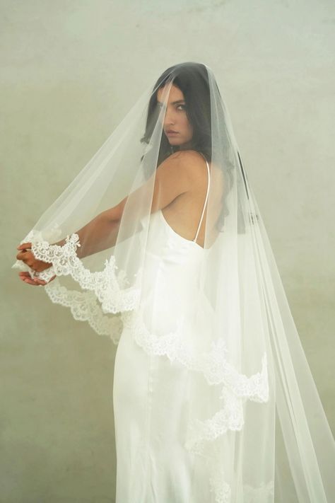 CHARLOTTE II - Drop Veil, Two Tier Lace Wedding Veil MADE TO ORDER * Handmade - all sales are final * Allow 4 - 6 weeks for production VEIL STYLE * Two-tier veil with corded lace trim * The veil is attached to a 3.5"/8.5cm wide metal wire comb VEIL SIZE * Chapel length 90"/228cm (shown)   * Cathedral 120"/308cm  TULLE * This veil is made with premium bridal illusion tulle COLOUR * Available in soft white (natural white) and ivory (warm white) * Need a tulle swatch? Order one here: https://www.et Vail Covering Face, Ruffled Wedding Veil, Modern Mantilla Veil, Long Blusher Veil, Long Veil With Blusher, Boho Veils Bridal, Two Tier Cathedral Wedding Veil, Lace Wedding Dress And Veil, Veil Attached To Dress