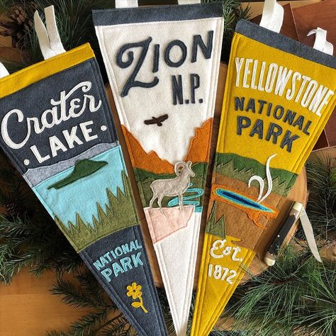 Yoho & Co. Designer Pennants on Instagram: “Designer pennants for all the national parks fans.  100% sewn, made in the Rockies. —— #craterlake #craterlakenationalpark…” Vintage Felt Pennants, Vintage Camp Interior Design, Vintage Camping Bedroom, Pennant Decor Ideas, Pennant Flags Boys Room, Vintage National Park Nursery, Camp Pennant Flags, Felt Pennant Flag, Outdoor Boys Room