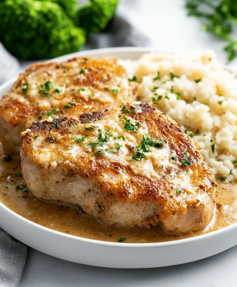 Juicy Garlic Parmesan Pork Chops cooked in a creamy, flavorful sauce. Perfect for a quick and easy dinner. Ready in just 30 minutes. Parmasean Pork Chops, Quick Pork Chops, Garlic Parmesan Pork Chops, Parmesan Pork Chops, Pork Seasoning, Italian Spices, Parmesan Recipes, Parmesan Sauce, Pork Ham