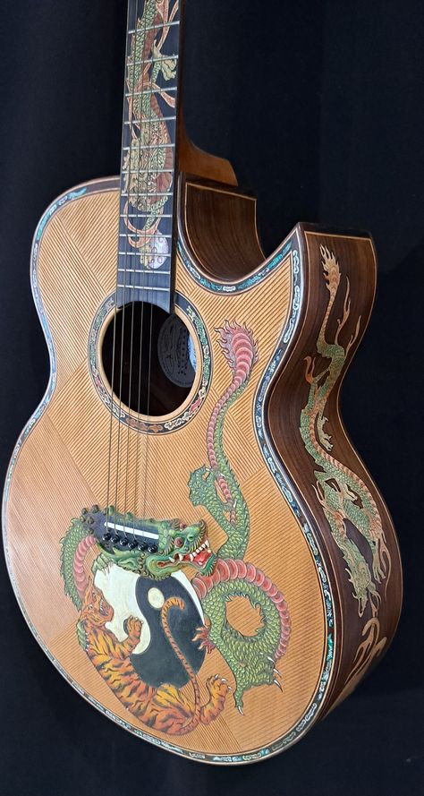 Blueberry NEW IN STOCK Handmade Acoustic Guitar Grand Concert Dragons & Tigers Watch and listen to a Blueberry Grand Concert Guitar in Action https://youtu.be/D_A5TUK-djE Blueberry Handmade Acoustic Guitars are made on the tropical island of Bali by our experienced team of traditional wood carvers and artisans who have been practicing their craft for generations.   Our unique workshop has been creating singular objects of musical and visual beauty since 2005.   This is your opportunity to own a Guitar Designs Acoustic, Cool Acoustic Guitar Designs, Custom Painted Guitar, Cool Acoustic Guitars, Art On Guitar, Acoustic Guitar Art, Custom Bass Guitar, Baritone Guitar, Guitar Obsession