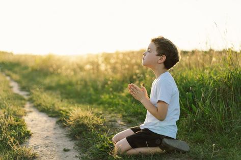 Premium Photo | Boy closed her eyes and praying in a field at sunset hands folded in prayer concept for faith spirituality and religion Field At Sunset, Classroom Background, Children Praying, Bible Images, Jesus Christ Art, Praying Hands, Prayer Board, Praying To God, Her Eyes