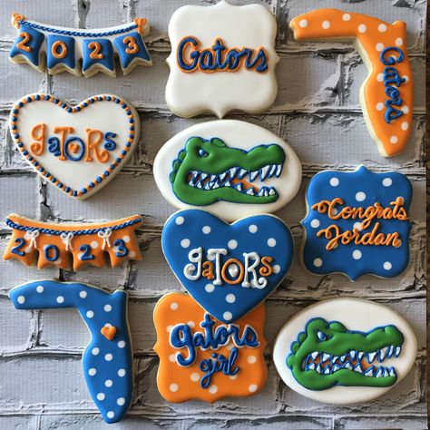 Custom UF Florida Gators Cookies  To see my other work or for more info on how to order, please visit my page or website.  www.facebook.com/busybeecakery  www.busybeecakery.com    Email: malinda@busybeecakery.com Florida Gator Cookies Decorated, Uf Themed Party, Florida Gators Birthday Party, Florida Gators Cookies, Florida Gator Party, Florida Gator Cookies, Gator Graduation Party, Uf Graduation Party Ideas, Gender Cookies