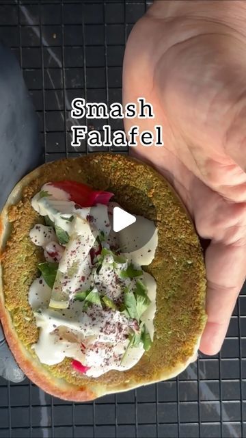 Zaid Dough on Instagram‎: "Smash falafel tortillas   ** Warning, highly addictive recipe **  Recipe yields 15 portions   500g of dry chickpeas will produce 1kg of soaked chickpeas   Chickpeas: 1kg (after soaking) Parsley: 56g (one bunch) Onion: 28g (1/2 medium onion) 1 Green Chili Pepper (optional)  Garlic: 11g (3 cloves)  **Falafel Spices:** 3 tbsp or 17g (store bought or make it yourself ⬇️ Salt: 16g (1 tbsp)  Water:100 mL  **Falafel Spices Mix:** Cumin: (2.5 tsp) 4.5g Coriander: (2.5 tsp) 4.5g Dill Seeds (عين الجرادة): (2.5 tsp) 4.5g Caraway Powder: (1.25 tsp) 2.5g Ginger: (1/8 tsp) 0.5g Cinnamon: (1/8 tsp) 0.5g  Simple steps  1. Wash 500g of dry chickpeas and soak them for 10 to 24 hours. For best results, soak for 12 hours. 2. Wash the soaked chickpeas before blending. 3. Start by ble Smash Falafel, Hummus Breakfast, Smash Tacos, Sandwiches Ideas, Dill Seeds, How To Make Falafel, Tahini Recipe, Green Chili Peppers, Dry Chickpeas