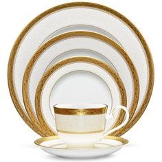 Odessa Gold features a wide, etched gold band, coupled with an inner band of delicate white florals over a whisper of dove gray. Crafted in fine bone china, Odessa Gold offers place setting components as well as an array of serving pieces and accessories. Odessa Gold is suitable for everyday use and is dishwasher safe! Color: cream,gold. Pattern: Scroll. Fine China Dinnerware, Waterford Lismore, Gold Dinnerware, Crystal Pattern, Crystals In The Home, China Sets, China Patterns, Beautiful Dishes, Place Setting