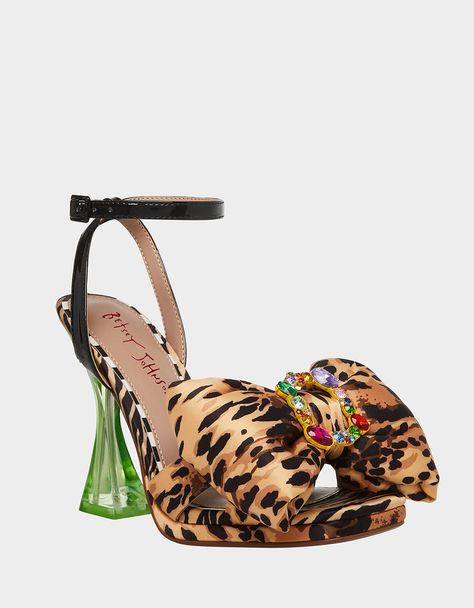 Make a statement in these eye-catching POLLIE heels! The vibrant colors and bow detail is sure to put a spring in your step and turn heads wherever you go. Printed textile heel with an embellished oversized bow Synthetic lining Synthetic sole 4 inch heel height Imported Quirky Aesthetic, Mini Frock, Betsey Johnson Clothes, Popular Handbags, Leopard Heels, Rhinestone Bow, Ribbon Design, Betsy Johnson, Dream Shoes