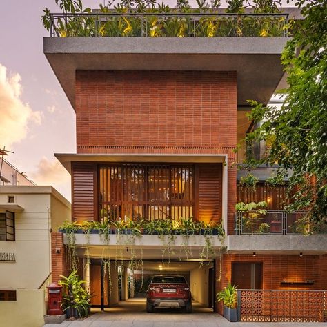 Intricate jali work and brick ground the design of this Bangalore home | Architectural Digest India Rustic Facade Design, Indian Bungalow, Building Massing, Modern Brick House, House Architecture Styles, Decor Lights, Bungalow Design, House Blend, Brick Facade