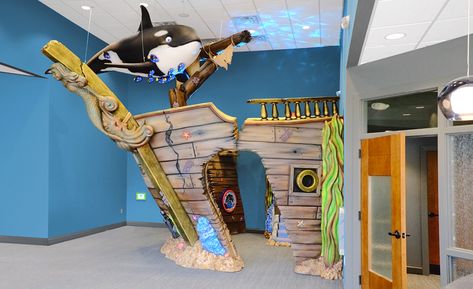 Shipwreck Play Area in Medical Waiting Room | Imagination Design Studios Pediatric Dental Office, Pediatric Dental, Faux Window, Parc D'attraction, Custom Murals, Waiting Area, Wood Detail, Indoor Playground, Design Studios