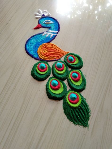 Siddhis rangoli art Rangoli Design For New Year, Short Rangoli, Rangoli For New Year, New Year Rangoli Design, Peacock Rangoli Design, Happy Holi Photo, New Year Rangoli, Peacock Rangoli, Holi Photo