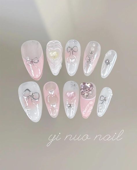 🎀 Dreamy Pink Ballet Core Nails 🎀 Elevate your nail game with these luxurious press-on nails, designed for those who appreciate elegance and intricate details. Featuring a stunning blend of soft pink and white tones, these nails are adorned with chic silver bows, shimmering pearls, and sparkling gemstones that catch the light beautifully. The 3D heart embellishments add a romantic touch, making these nails perfect for special occasions or simply to add a bit of glam to your everyday look. Craf Nails Cute Pink, Belle Nails, Coquette Ballet, Hand Painted Nails, Bow Nails, Nails Hand Painted, Cute Pink Nails, Ballet Nails, Nails 3d