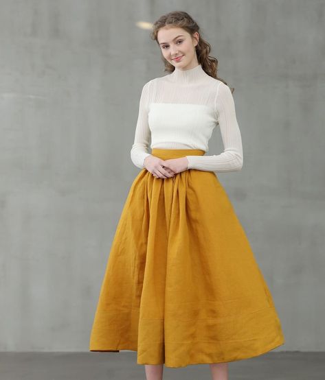 @linennaive posted to Instagram: Home, business, park, where will you want to wear this skirt? Clean, crisp and polished: Mustard YELLOW Skirt is a timeless wardrobe staple. The designer team want to find you something perfect at the beginning of the new style. :) . . . #slowliving #slowlife #slowfashion #timelessfashion #sustainablefashion #wardrobeessentials #sustainablebrand #naturalfabrics #ethicalfashion #organicclothing #fortheloveoflinen #linenstyle #linenclothing #linenlover #casualskirt 1950 Skirt, Yellow Skirt Outfits, Mustard Yellow Skirts, Mustard Skirt, Skirt A Line, Yellow Skirt, Skirt Trends, Skirt Pleated, Line Skirt