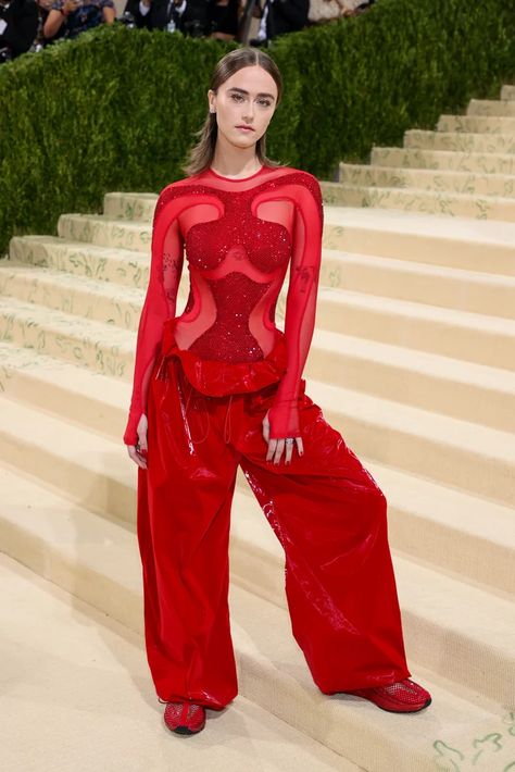 Trust Ella Emhoff to make baggy pants and sneakers look glamorous as ever. For her Met Gala debut, the second daughter and newly minted model wore head-to-toe Adidas by Stella McCartney, walking the red carpet in a diamond mesh bodysuit, oversize trousers, and sneakers all in the same shade of bright red. Though the cool, comfy vibe was classic Ella, the skintight top with glitter cutouts, which she accessorized with Cartier jewelry and a Stella McCartney purse, was unlike anything we've ever se Ella Emhoff, Georgina Chapman, Met Gala Red Carpet, Teyana Taylor, A$ap Rocky, Anja Rubik, Red Carpet Look, Tessa Thompson, Keke Palmer