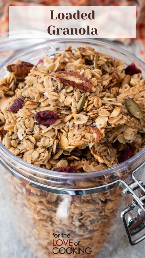 This easy-to-make homemade loaded granola recipe is filled with oats, pecan pieces, pumpkin seeds, almonds, chia seeds, coconut, dried cranberries, and maple syrup for sweetness.     #recipe #granola #breakfast #breakfastideas #snacks #healthysnacks #homemadegranola Gronala Recipes, Fall Granola Recipe, Maple Granola Recipe, Coconut Granola Recipe, Healthy Homemade Granola Recipe, Maple Granola, Homemade Granola Healthy, Granola Recipe Healthy, Best Granola